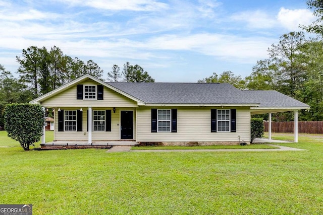 ranch-style house with a carport, covered porch, a front yard, and fence