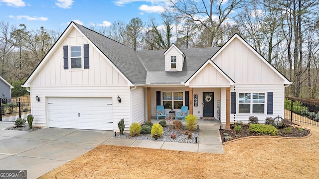 modern inspired farmhouse with an attached garage, board and batten siding, fence, covered porch, and driveway