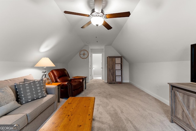 living area with lofted ceiling, baseboards, carpet floors, and ceiling fan