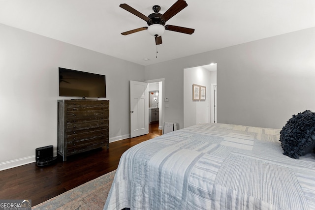 bedroom with ceiling fan, baseboards, and wood finished floors