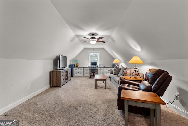 living area with baseboards, light carpet, a ceiling fan, and vaulted ceiling