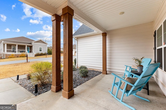 view of patio featuring a porch