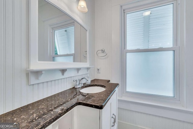 bathroom featuring a healthy amount of sunlight and vanity