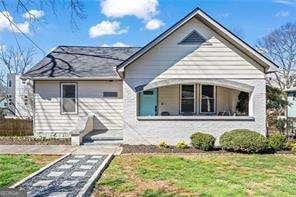 bungalow-style house with a front yard