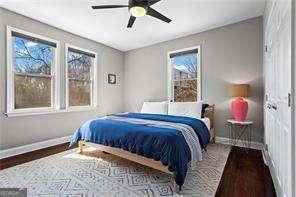 bedroom with wood finished floors, baseboards, and ceiling fan