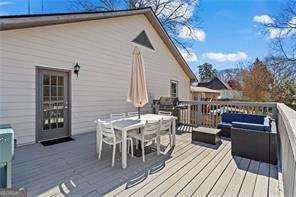 wooden deck with outdoor dining area