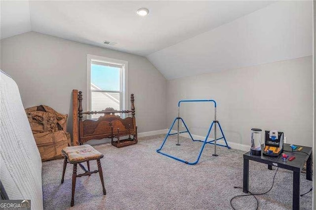 rec room featuring baseboards, lofted ceiling, visible vents, and carpet flooring