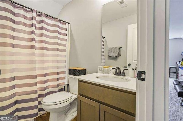 full bath with vanity, toilet, and visible vents