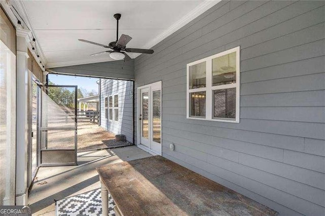 exterior space with lofted ceiling and ceiling fan