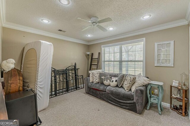 living room with visible vents, carpet flooring, a textured ceiling, and crown molding