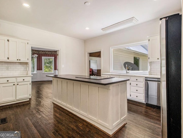 kitchen featuring white cabinets, dark wood-style floors, and stainless steel appliances