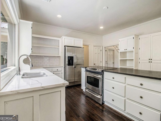 kitchen featuring open shelves, light stone counters, appliances with stainless steel finishes, and a sink