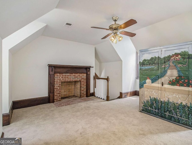 interior space with lofted ceiling, visible vents, and carpet floors