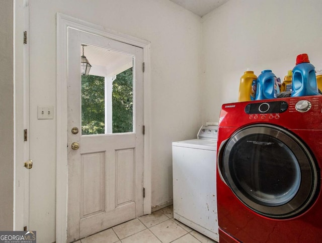 laundry room with tile patterned flooring, laundry area, and independent washer and dryer