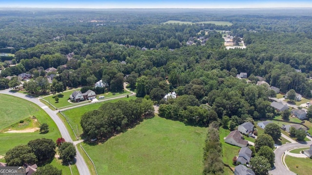 aerial view with a wooded view