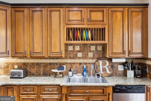 kitchen with brown cabinets, dishwasher, and a sink