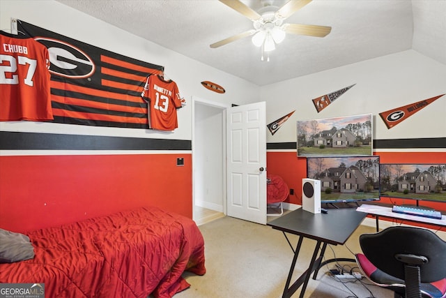 bedroom with lofted ceiling, carpet, and a textured ceiling