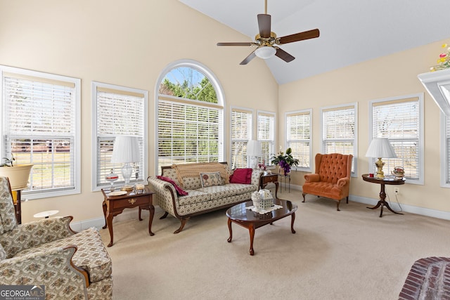 sunroom / solarium with a ceiling fan and vaulted ceiling