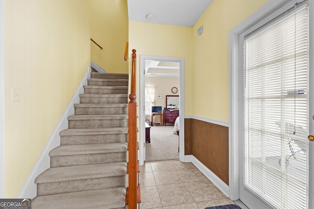 stairs featuring tile patterned flooring and baseboards