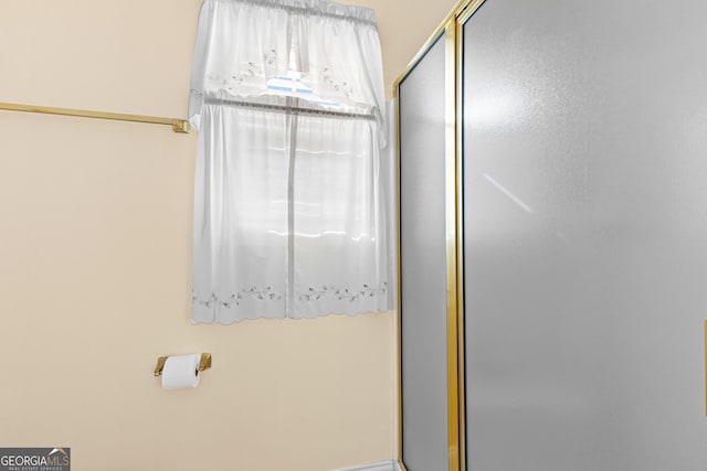 full bathroom with a stall shower