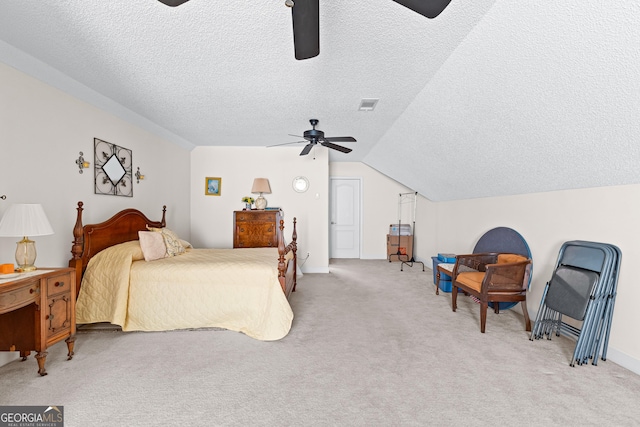 bedroom featuring visible vents, ceiling fan, light colored carpet, lofted ceiling, and a textured ceiling