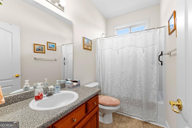 bathroom featuring tile patterned flooring, shower / tub combo with curtain, toilet, and vanity