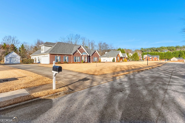 view of front of home with brick siding, a shingled roof, and a front yard