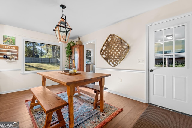 dining room with light wood finished floors and baseboards