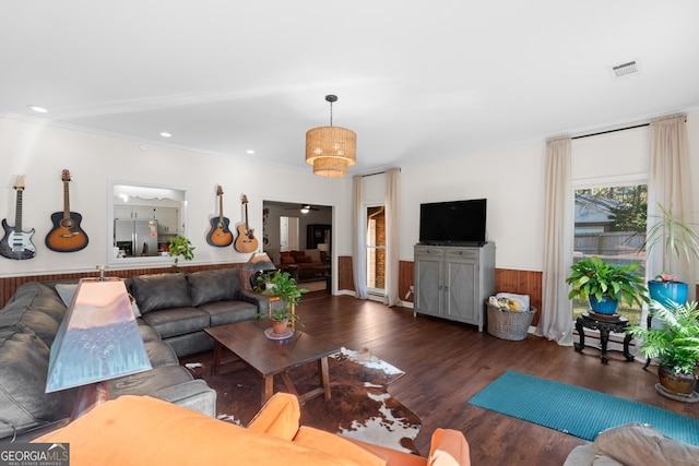 living area featuring recessed lighting, visible vents, wainscoting, and wood finished floors