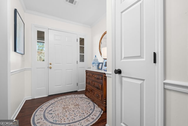 entryway with visible vents, baseboards, ornamental molding, and dark wood-style flooring