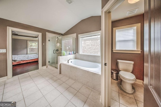 bathroom with visible vents, ensuite bathroom, a shower stall, a bath, and vaulted ceiling