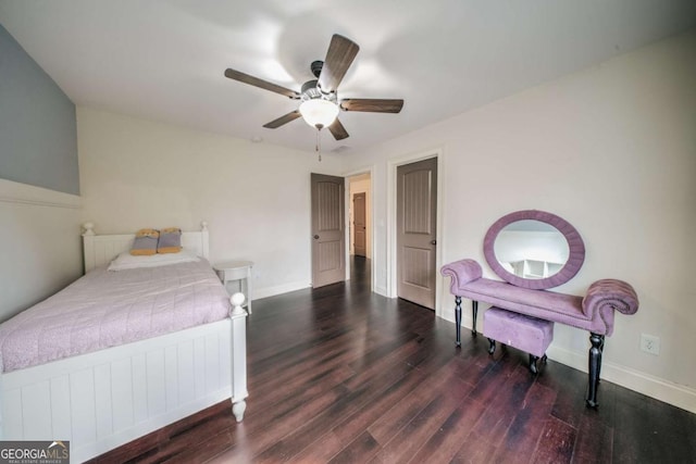 bedroom with a ceiling fan, wood finished floors, and baseboards