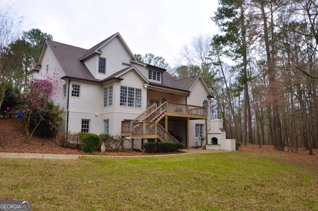 1070 Lexington Ct, Bishop, GA 30621 - view of front of house with a fireplace, stairs, a front yard, and a deck