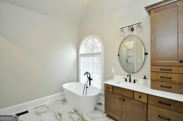 1070 Lexington Ct, Bishop, GA 30621 - full bath with vanity, a freestanding tub, marble finish floors, and vaulted ceiling
