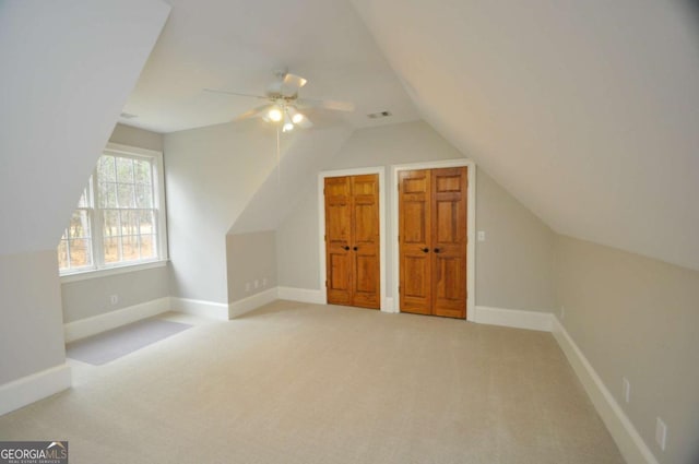 additional living space featuring visible vents, carpet floors, and baseboards