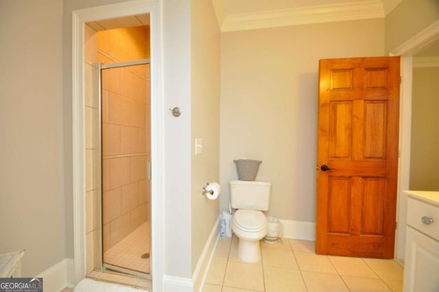 full bath featuring baseboards, a stall shower, crown molding, toilet, and tile patterned floors