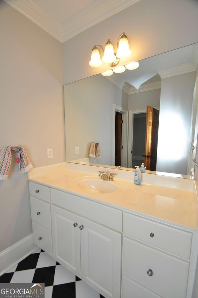 bathroom featuring tile patterned floors, ornamental molding, and vanity