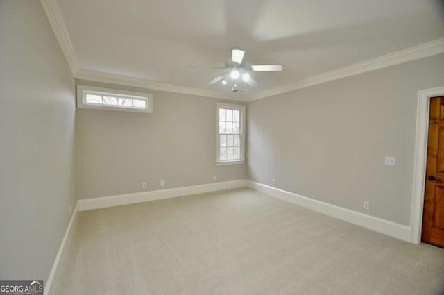 empty room featuring baseboards, light carpet, and ornamental molding