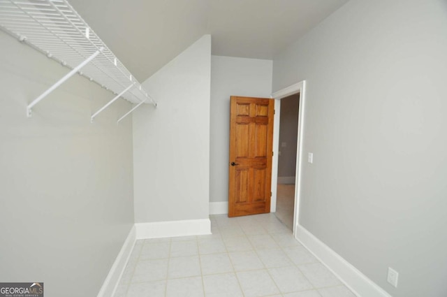 spacious closet with light tile patterned flooring