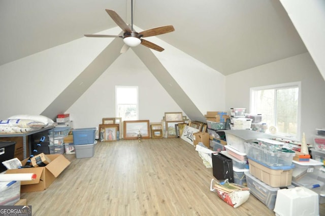 additional living space featuring wood finished floors, a ceiling fan, and vaulted ceiling