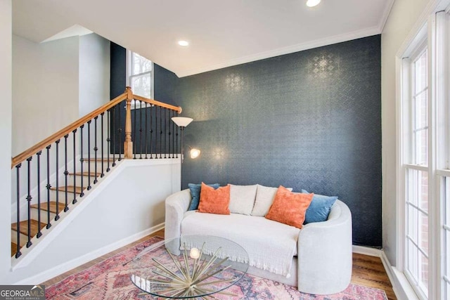 living room featuring wood finished floors, recessed lighting, wallpapered walls, baseboards, and an accent wall