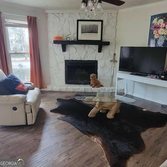 4906 Kellys Mill Dr NW, Lilburn, GA 30047 - living room featuring ornamental molding, a fireplace, wood finished floors, and a ceiling fan