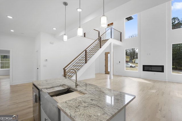 kitchen featuring plenty of natural light and a sink