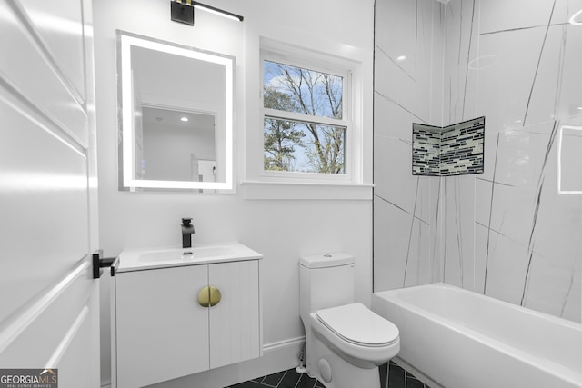 bathroom featuring toilet, vanity, baseboards, and shower / bathing tub combination