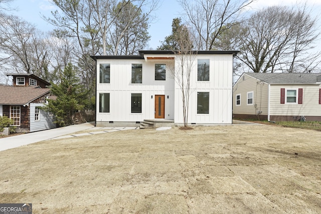 modern inspired farmhouse with crawl space and board and batten siding