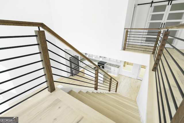 stairway with wood finished floors