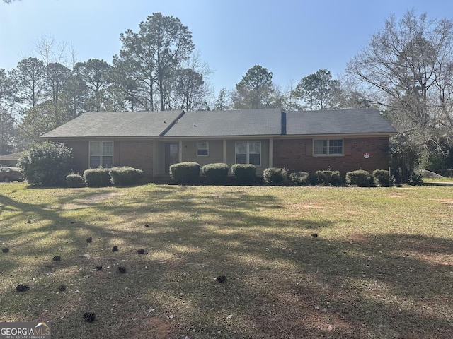 back of house with a lawn