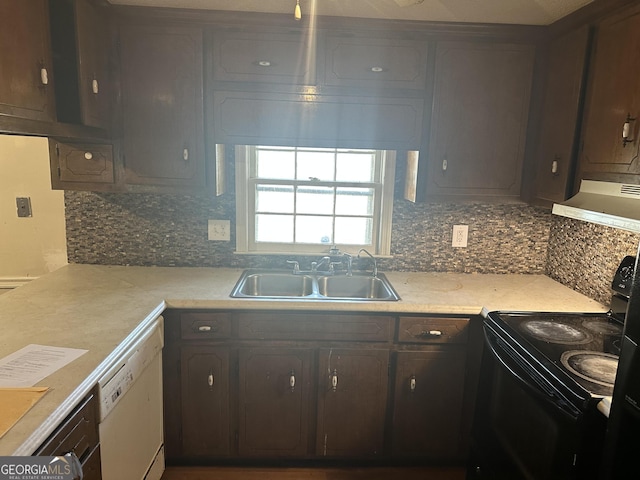 kitchen featuring black electric range, a sink, range hood, light countertops, and dishwasher