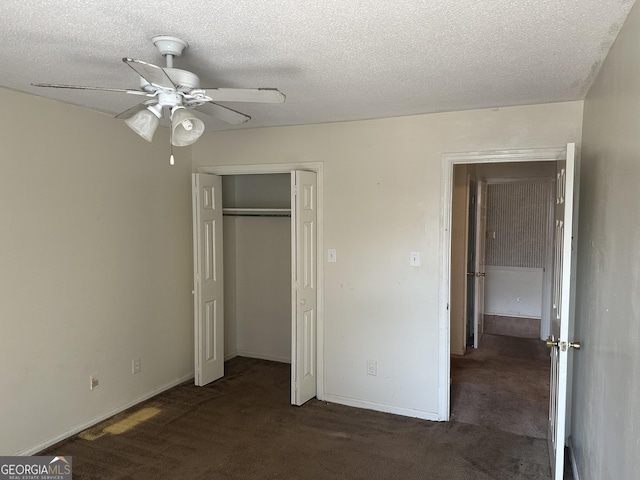 unfurnished bedroom with carpet floors and a textured ceiling