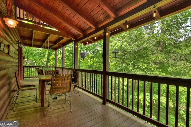 deck featuring outdoor dining area